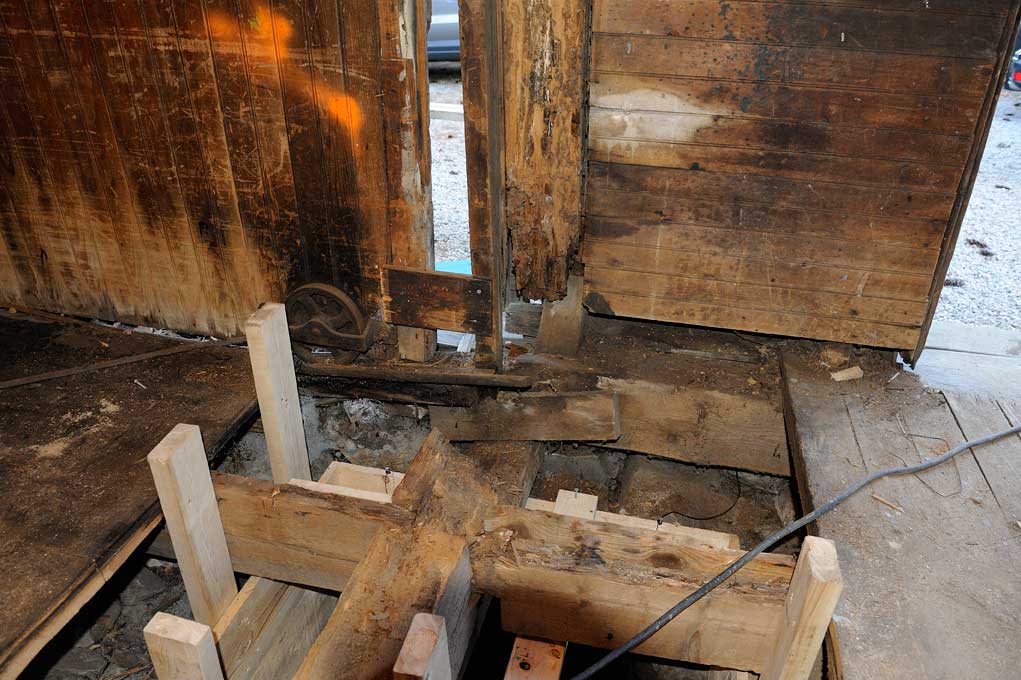 Rotten framing inside old carriage house