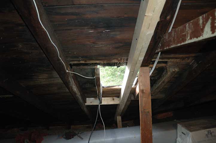 New rafter installed to fill opening left by chimney