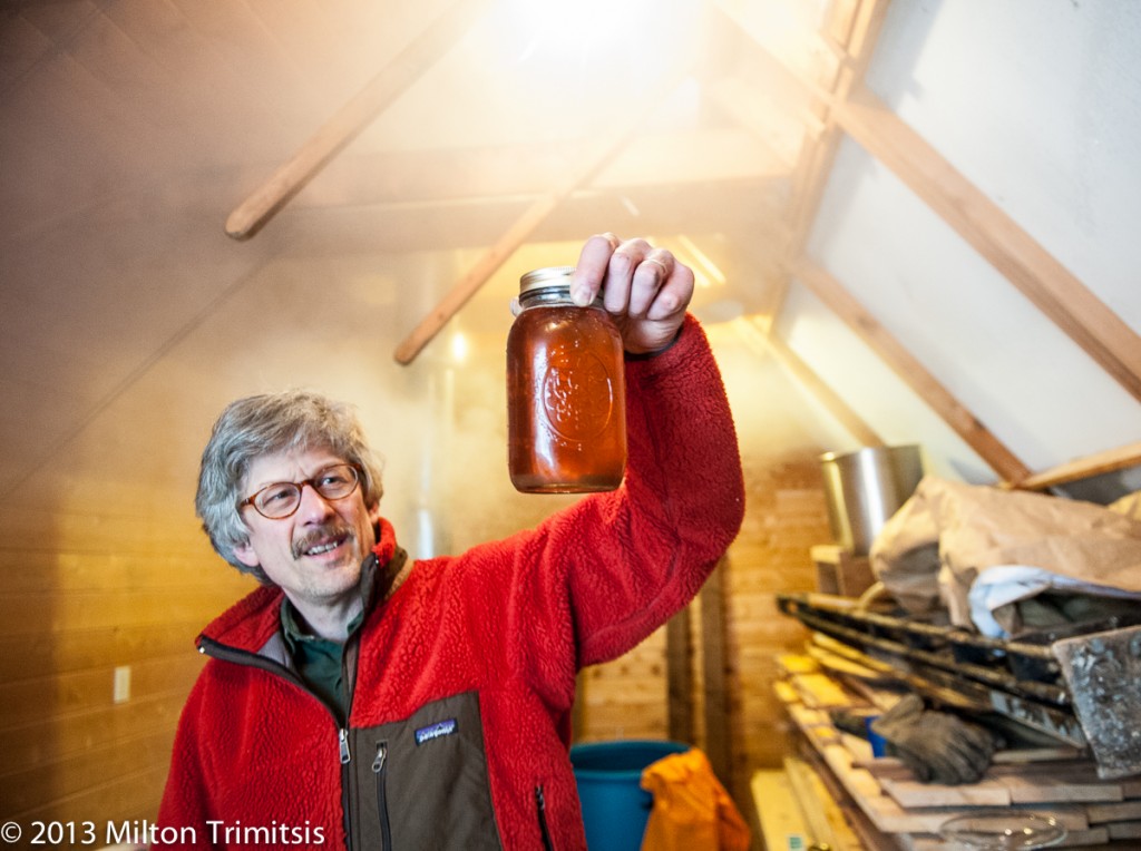 Paul Koval holding jar of maple syrup