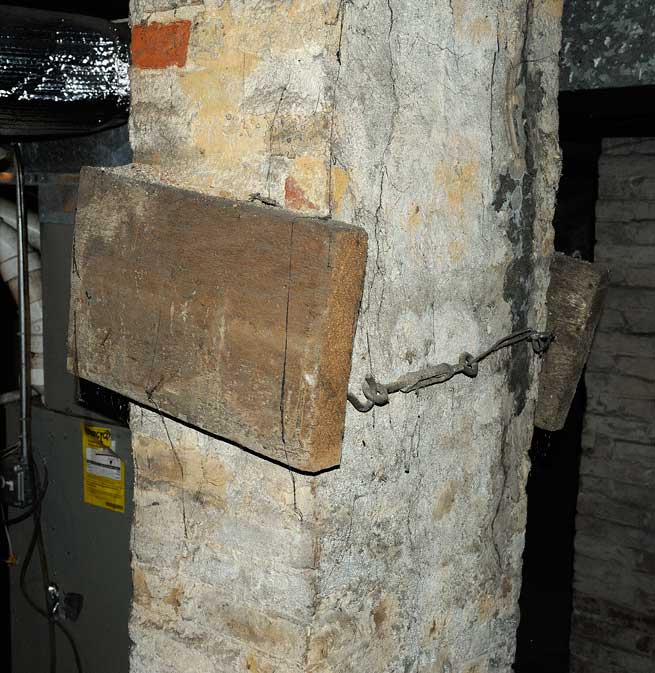 Damaged chimney held together by wood splint