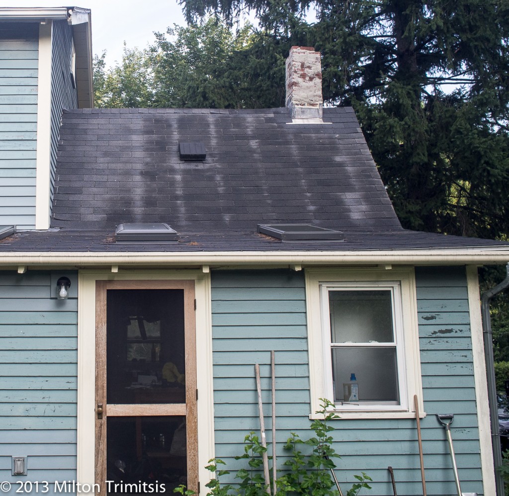 Pitched asphalt shingle roof with stripes showing thermal bridging