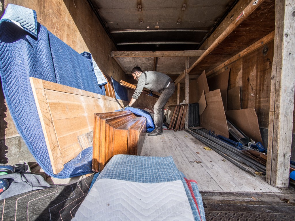 Loading salvaged library cabinets into box truck