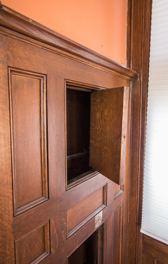 hidden compartment in paneled oak mantel from 19th century