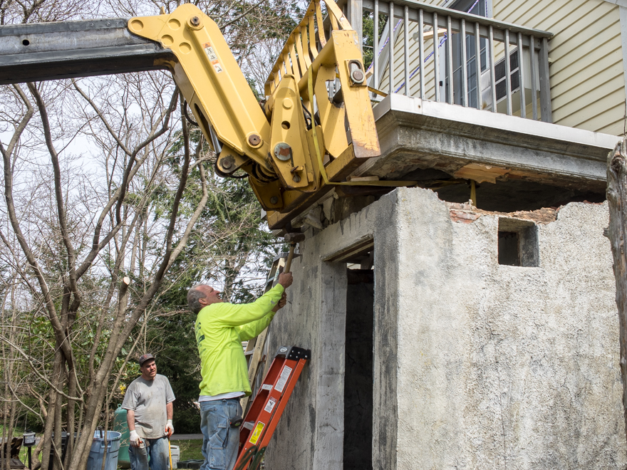 Demolishing concrete and terra-cotta block wall