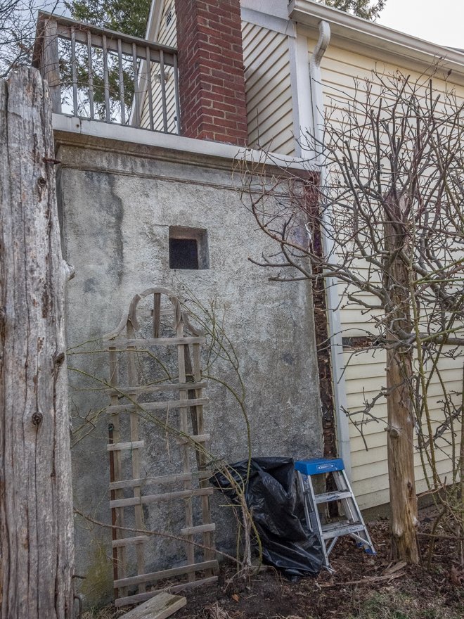 Concrete shed behind barn